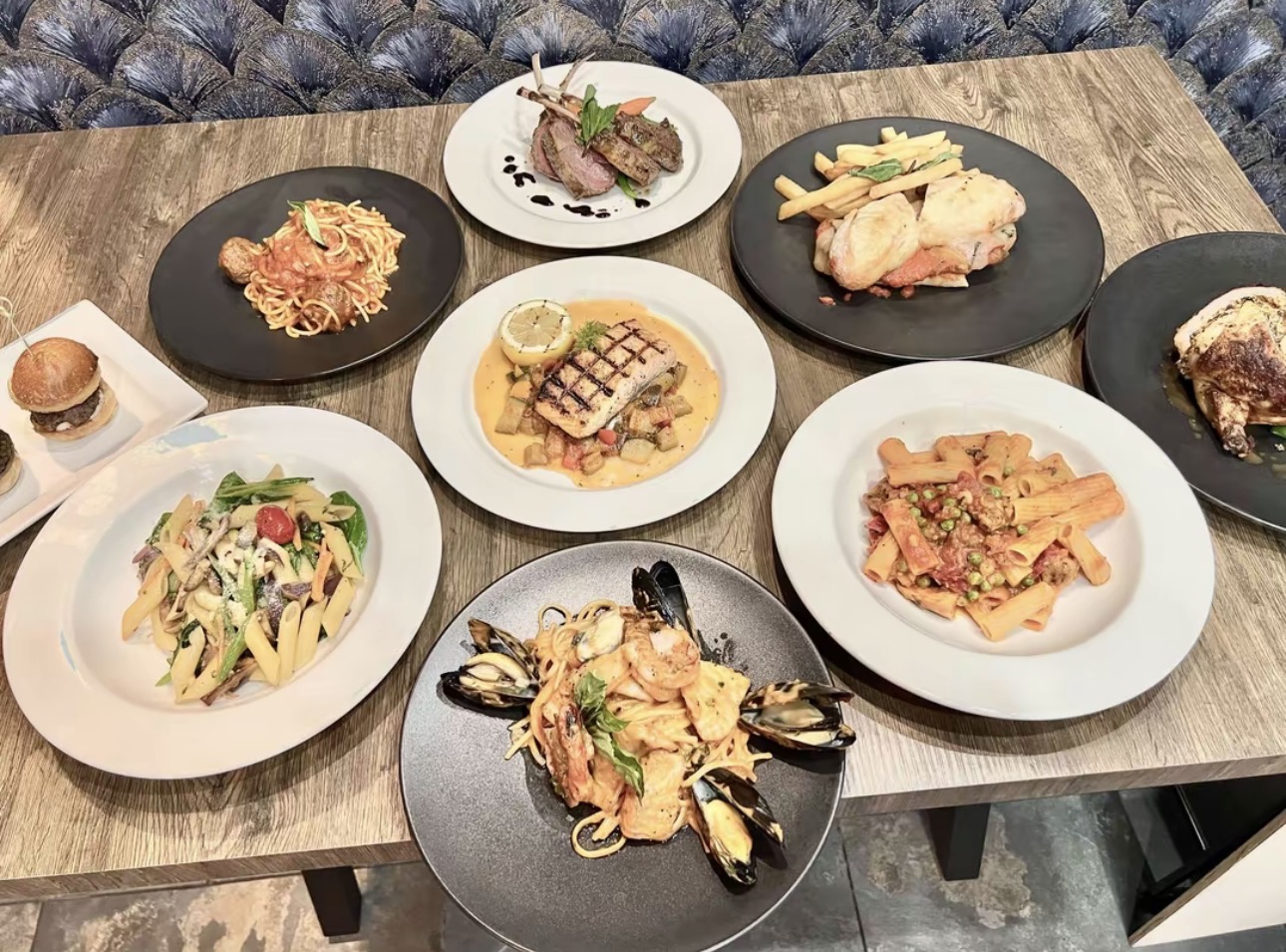 Elegant tasting plates of pasta, lamb and seafood